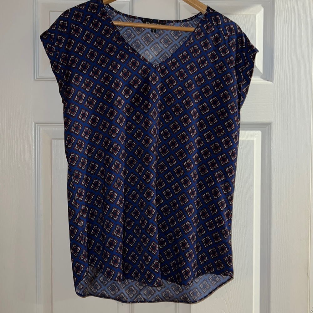 Express blue vneck blouse with orange, black, and white design